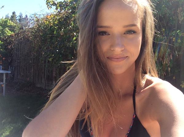 Helen Owen in a bikini taking a selfie