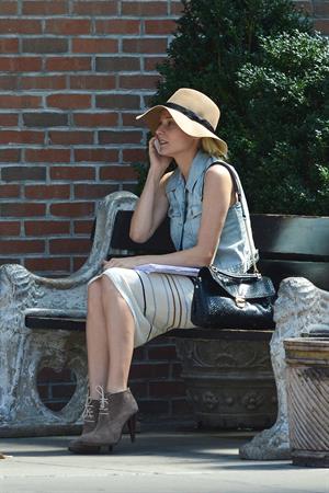 Diane Kruger - Wears a denim vest with a skirt as she chats on her cellphone while out the Bowery on September 12, 2012