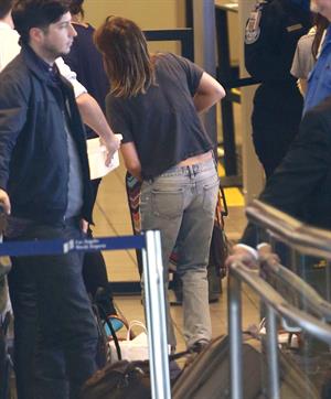 Emma Roberts departing on a flight at LAairport in Los Angeles, California on December 22, 2012 