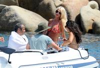 Victoria Silvstedt wearing a bikini on a board in Sardinia on August 8, 2012