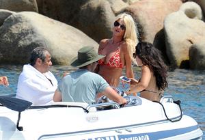 Victoria Silvstedt wearing a bikini on a board in Sardinia on August 8, 2012
