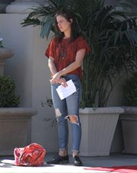 Jessica Stroup takes a break on the set of 90210 in Los Angeles on February 26, 2013