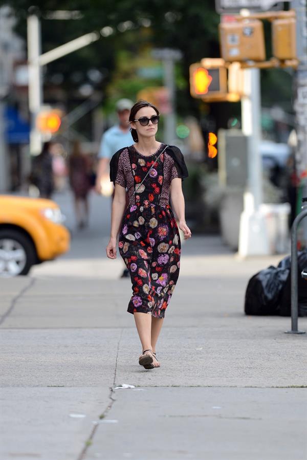 Keira Knightley wears a dark floral dress while strolling in New York City on August 7, 2012