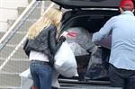 Kimberly Stewart Donating a trunk full of designer clothes at Wasteland in Los Angeles (November 15, 2012) 