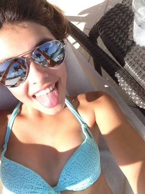 Madison Beer in a bikini taking a selfie