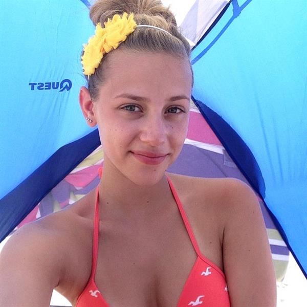 Lili Reinhart in a bikini taking a selfie