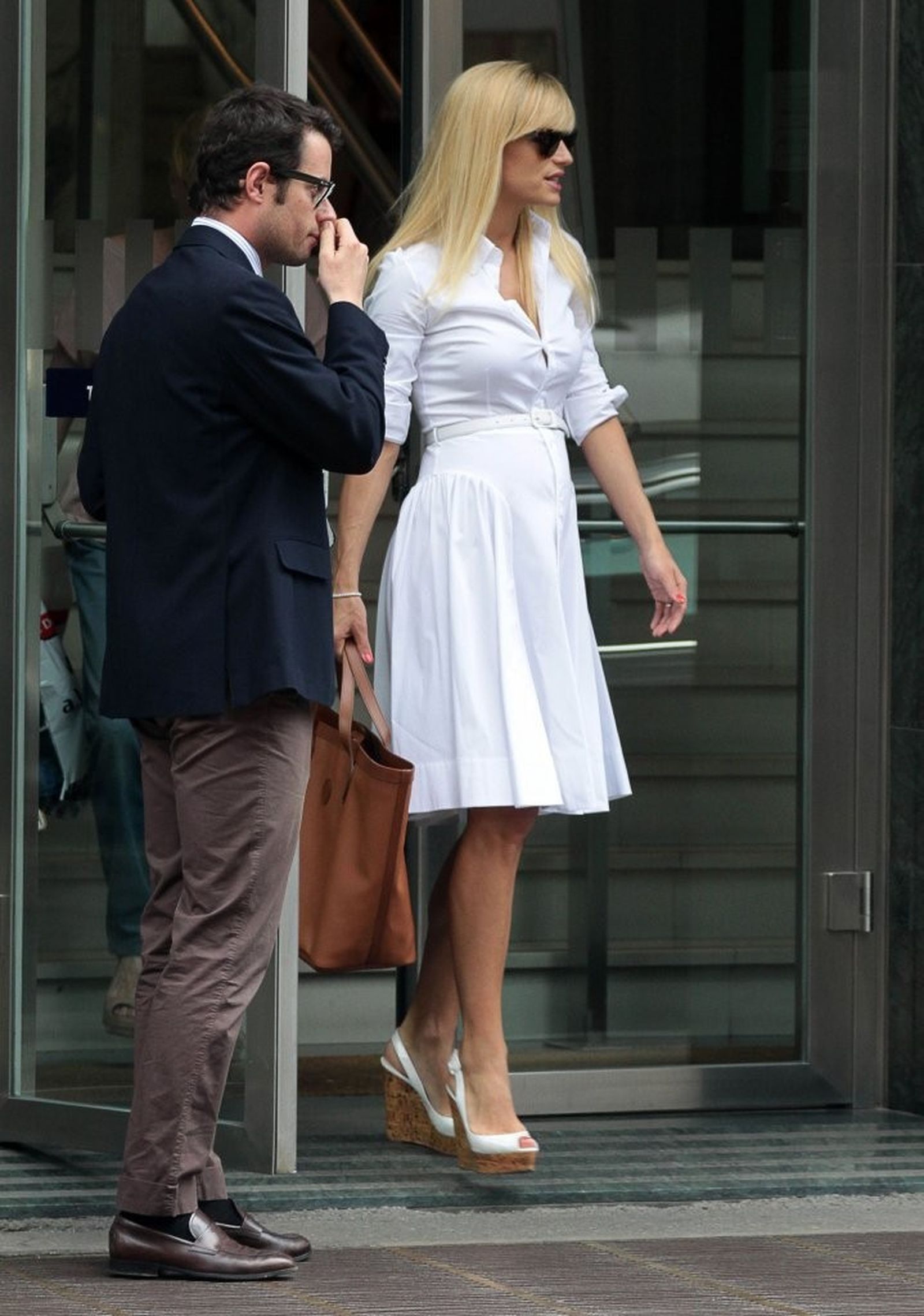 Michelle Hunziker Pictures Michelle Hunziker Leaving her house in a white dress in Milan Italy on May 9, 2013