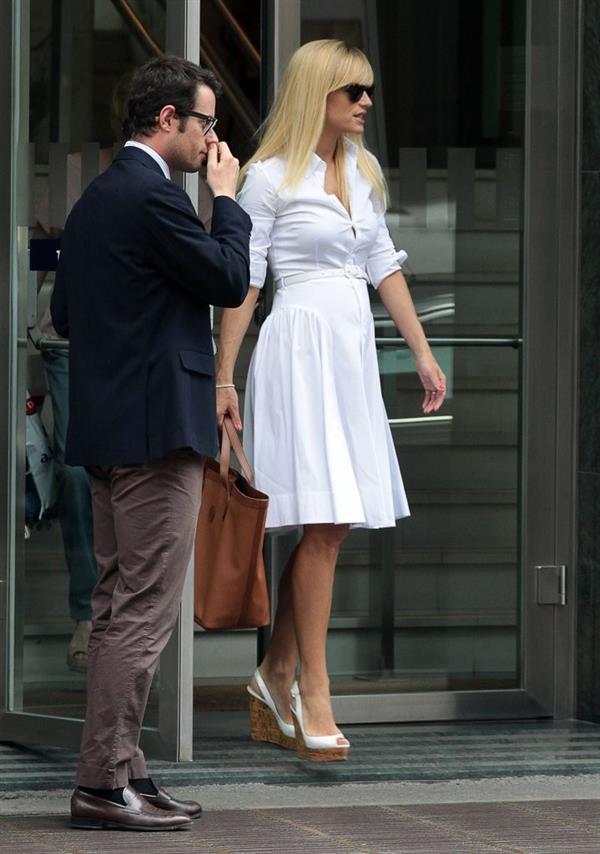 Michelle Hunziker Leaving her house in a white dress in Milan Italy on May 9, 2013