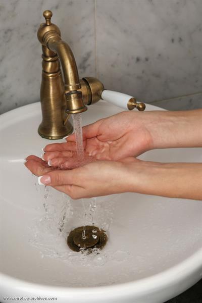 Tiffany in  Bano  for Errotica Archives - Tiffany flaunts her smooth, plump pussy in front of the camera.