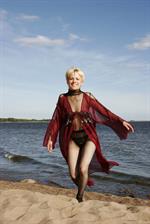 Darcia in  Presenting Darcia  for Erotic Beauty - Darcia playfully poses at the beach baring her petite body.