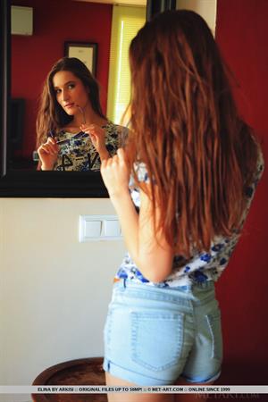 Elina Pictures Elina in Detarce for MetArt - Elina strips on the couch baring her sexy hips and trimmed pussy.