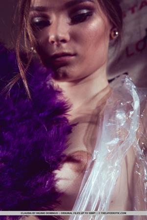 Claudia wraps her sexy, tight body on plastic as she plays with her pussy.