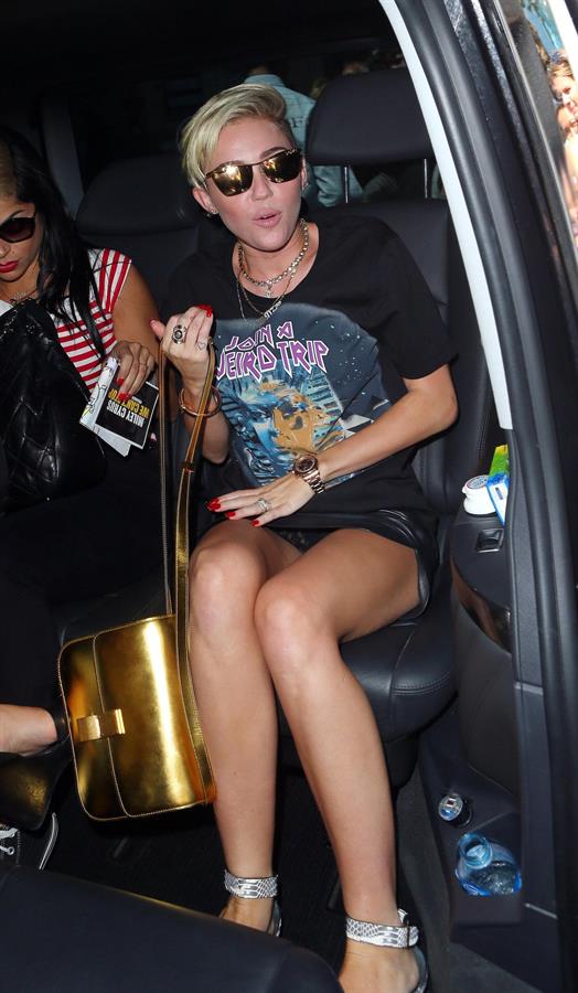 Miley Cyrus Spotted in a Join A Weird Trip T-shirt outside the London Studios in London (18.07.2013) 