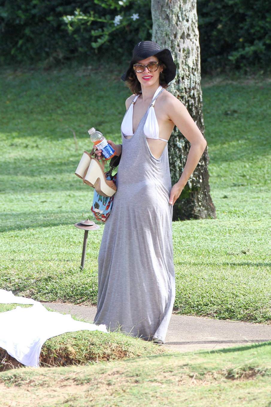 Milla Jovovich on the beach in a bikini on New Years Eve in Maui, Hawaii December 31, 2012 