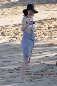 Milla Jovovich on the beach in a bikini on New Years Eve in Maui, Hawaii December 31, 2012 