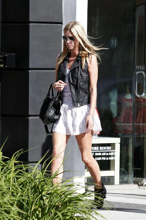 Nicky Hilton in a short white dress while shopping in Beverly Hills March 1, 2013 