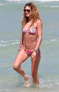 Doutzen Kroes enjoys a day on the beach in Miami Beach, FL on April 28, 2013