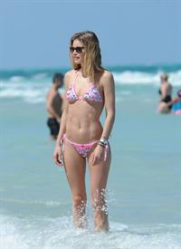Doutzen Kroes enjoys a day on the beach in Miami Beach, FL on April 28, 2013