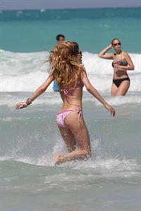 Doutzen Kroes enjoys a day on the beach in Miami Beach, FL on April 28, 2013