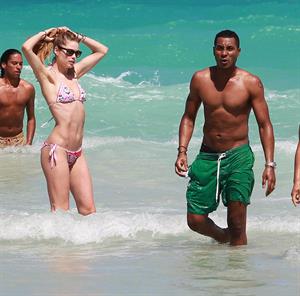 Doutzen Kroes enjoys a day on the beach in Miami Beach, FL on April 28, 2013