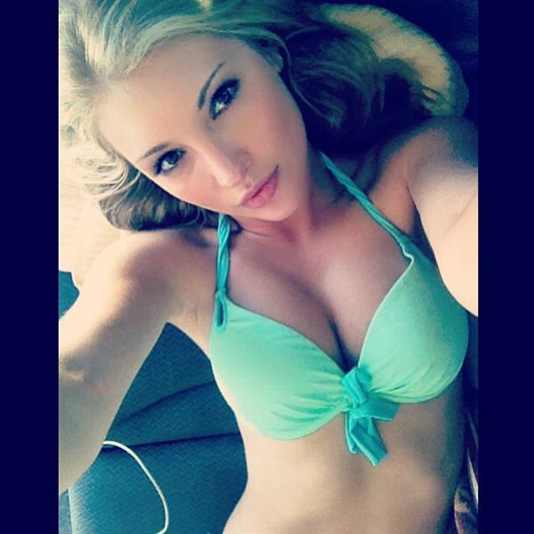 Anna Faith Carlson in a bikini taking a selfie