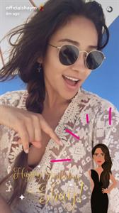 Shay Mitchell taking a selfie