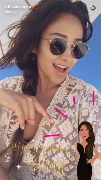 Shay Mitchell taking a selfie