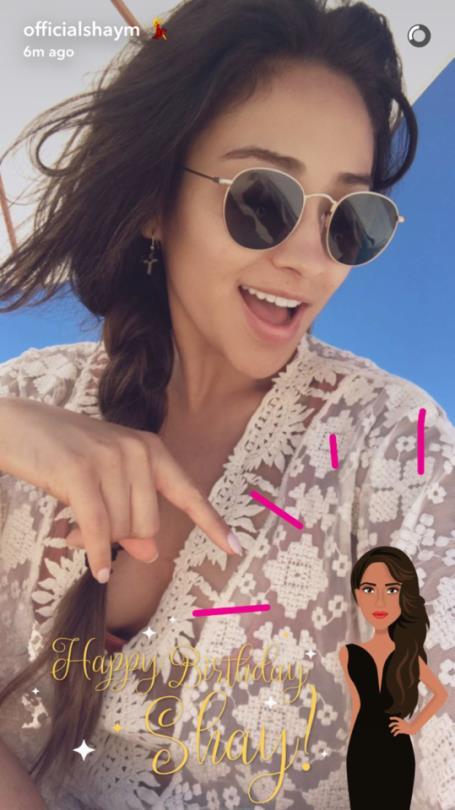 Shay Mitchell taking a selfie