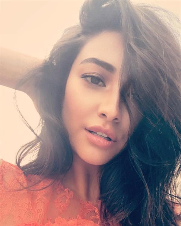 Shay Mitchell taking a selfie