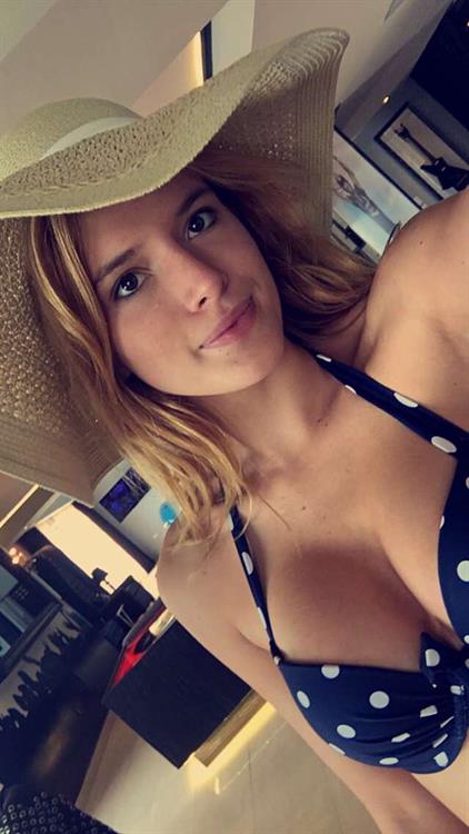 Bella Thorne in a bikini taking a selfie