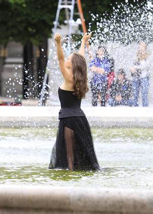 Natalie Portman modeling for a Miss Dior campaign photo shoot in the gardens of the Palais Royal in Paris 6/26/12 