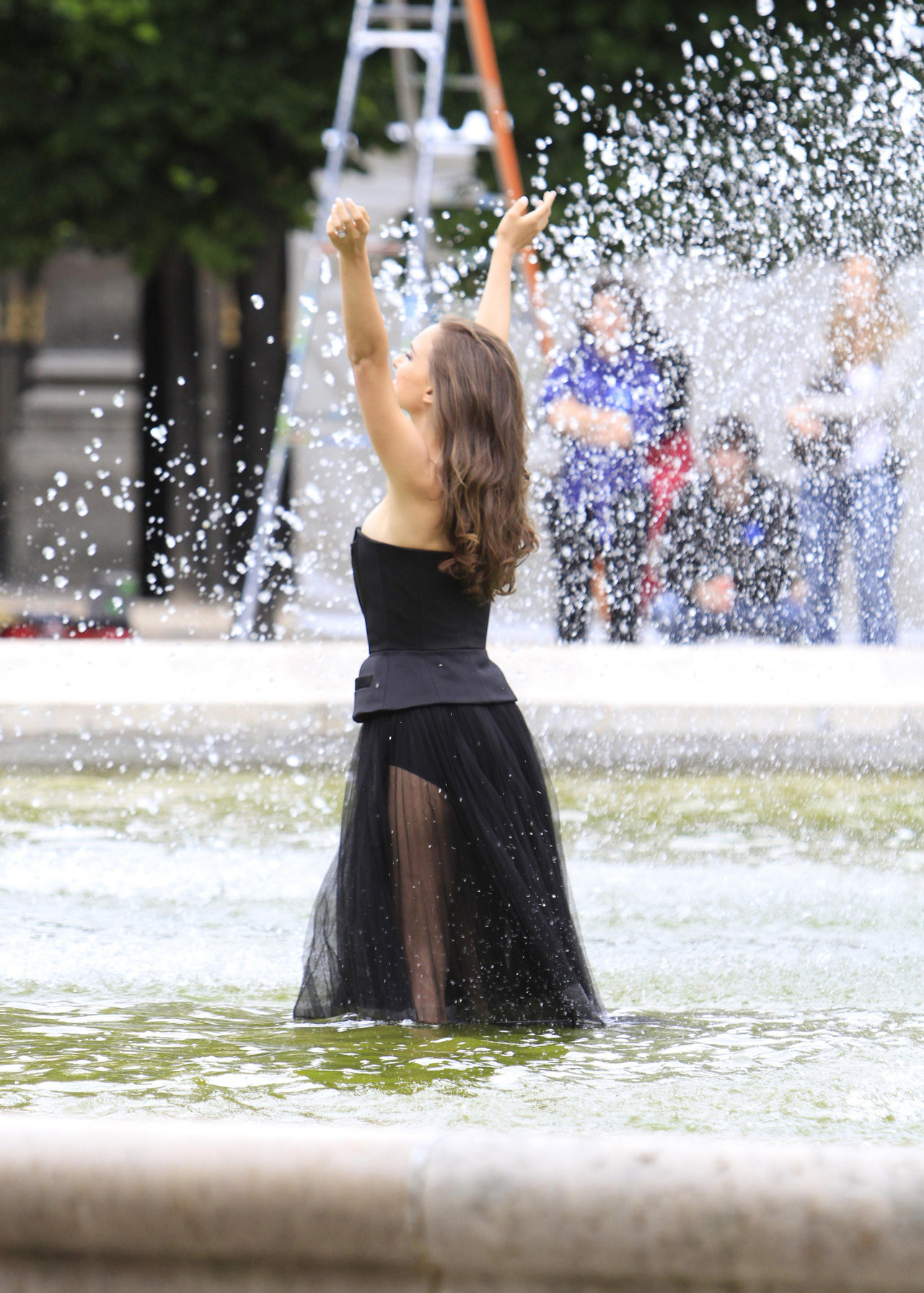 Natalie Portman Pictures Natalie Portman modeling for a Miss Dior campaign photo shoot in the gardens of the Palais Royal in Paris 6/26/12