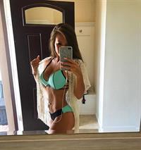 Taylor Alesia in a bikini taking a selfie