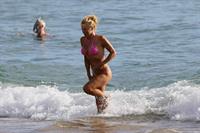 Pamela Anderson Wearing bikini on the beach in Hawaii - August 8, 2013 