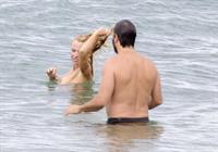 Pamela Anderson Pamela Anderson Going topless at the beach in France 02.10.13