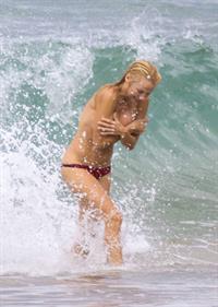Pamela Anderson Pamela Anderson Going topless at the beach in France 02.10.13
