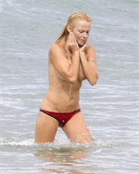 Pamela Anderson Pamela Anderson Going topless at the beach in France 02.10.13