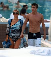 Paris Hilton spends the day in and out of the pool in Miami December 8, 2012