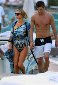 Paris Hilton spends the day in and out of the pool in Miami December 8, 2012