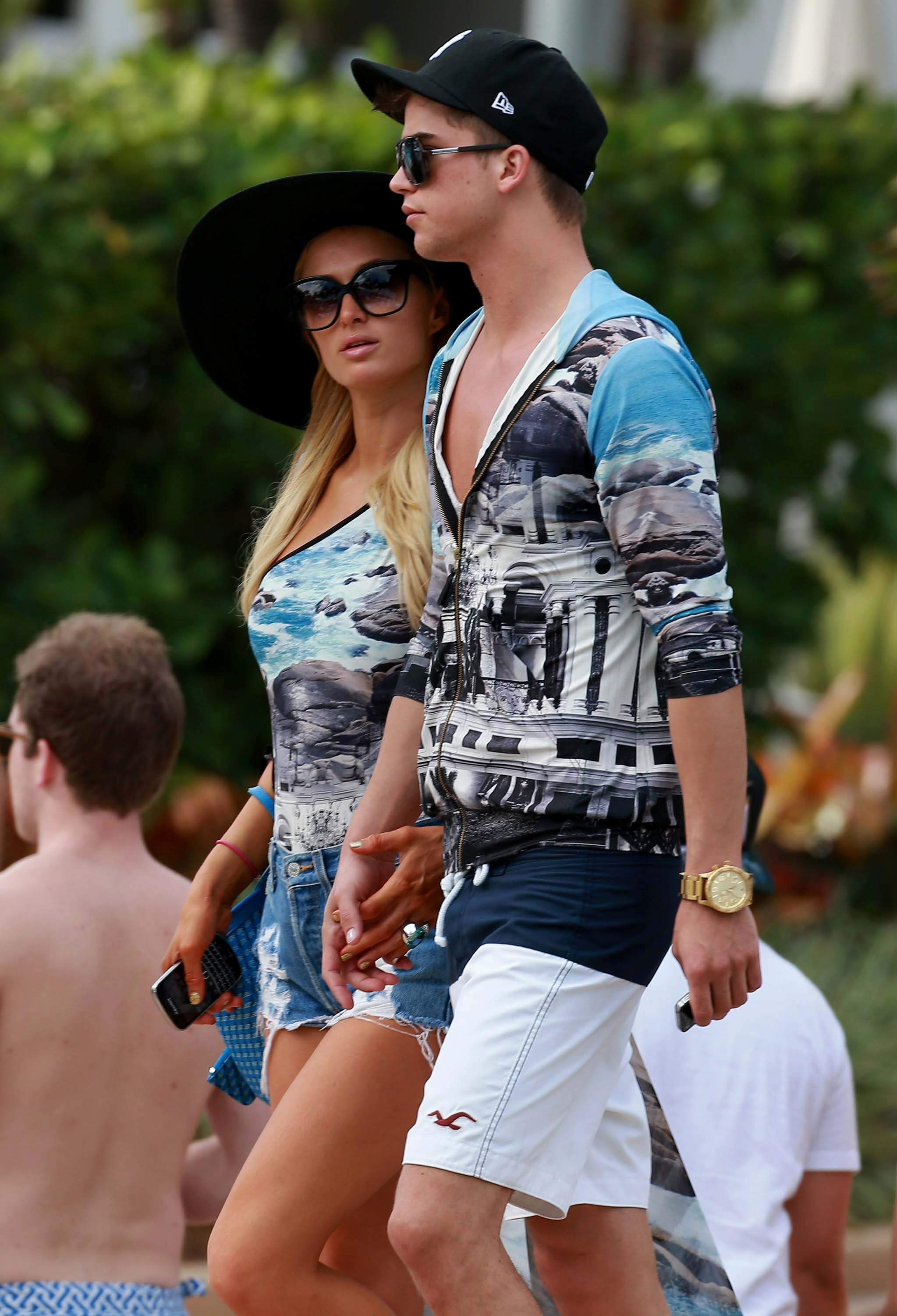 Paris Hilton spends the day in and out of the pool in Miami December 8, 2012