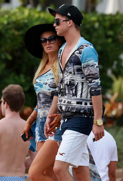 Paris Hilton spends the day in and out of the pool in Miami December 8, 2012