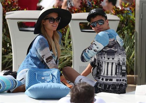 Paris Hilton spends the day in and out of the pool in Miami December 8, 2012