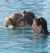 Paris Hilton spends the day in and out of the pool in Miami December 8, 2012