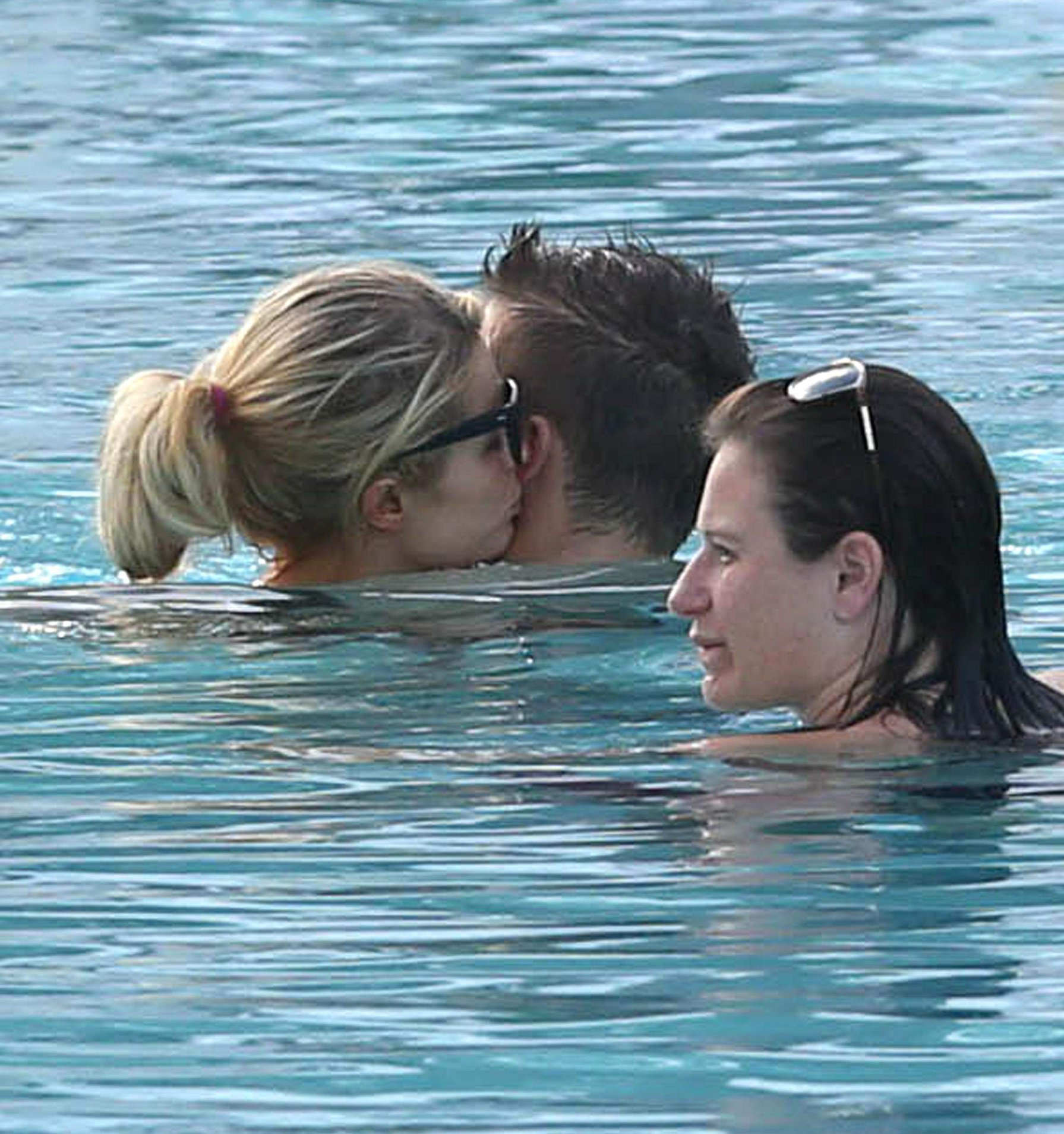 Paris Hilton spends the day in and out of the pool in Miami December 8, 2012