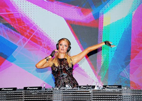 Paris Hilton walks for designer duo Shane and Falguni Peacock and performs as a DJ at the India Resort Fashion Week