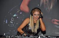 Paris Hilton walks for designer duo Shane and Falguni Peacock and performs as a DJ at the India Resort Fashion Week