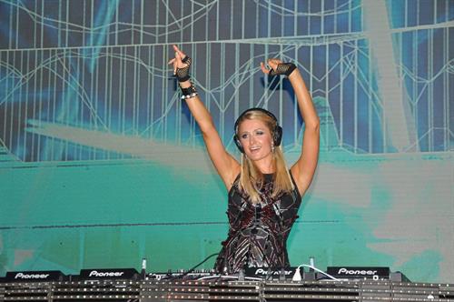 Paris Hilton walks for designer duo Shane and Falguni Peacock and performs as a DJ at the India Resort Fashion Week