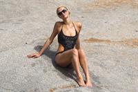 Paris Hilton - Wearing a swimsuit at a beach in France August 6, 2012