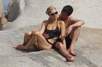 Paris Hilton - Wearing a swimsuit at a beach in France August 6, 2012