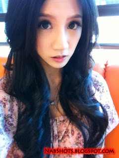 Lin Cai Ti taking a selfie